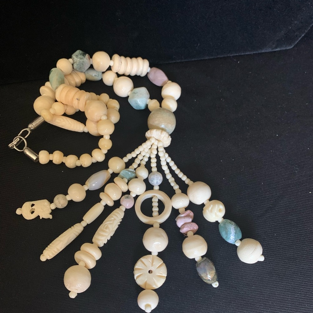Vintage faux bone carved necklace. 18” + 4” dangles